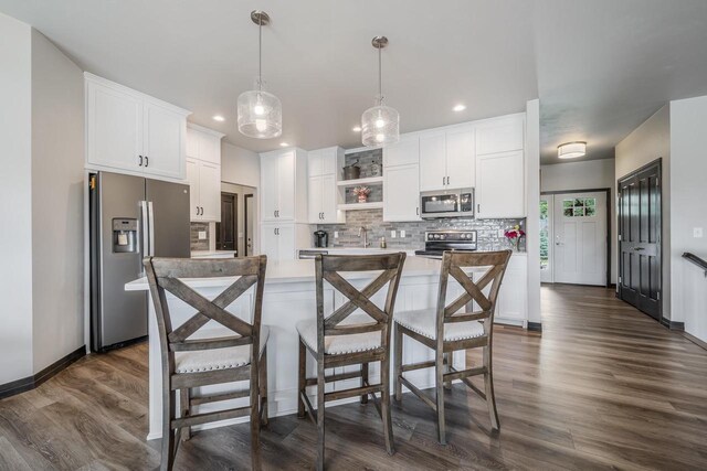 5090 N Milkweed Trl, Appleton, WI 54913 - kitchen featuring appliances with stainless steel finishes, decorative backsplash, open shelves, white cabinetry, and dark wood-style floors