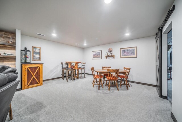 5090 N Milkweed Trl, Appleton, WI 54913 - dining area featuring carpet, recessed lighting, and a barn door