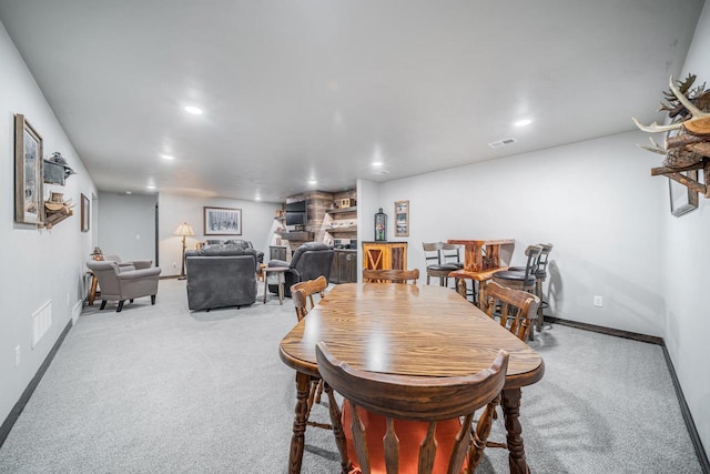 5090 N Milkweed Trl, Appleton, WI 54913 - dining area featuring carpet floors, recessed lighting, and a stone fireplace