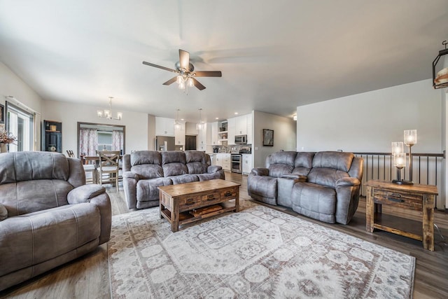 5090 N Milkweed Trl, Appleton, WI 54913 - living area with wood finished floors, a chandelier, and ceiling fan