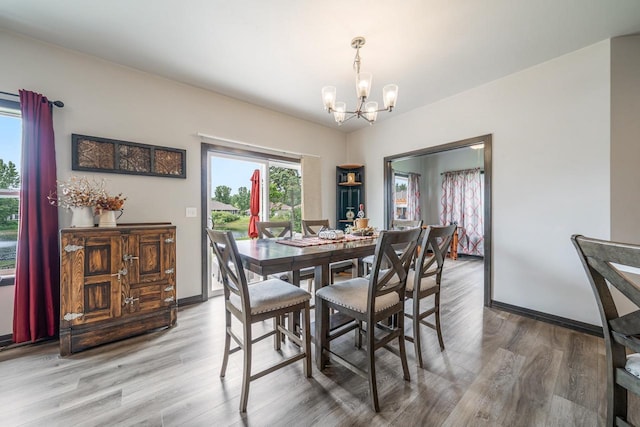 5090 N Milkweed Trl, Appleton, WI 54913 - dining area with a chandelier and wood finished floors