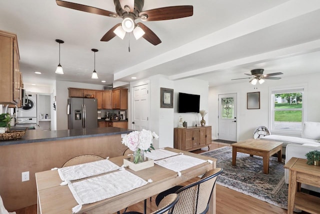 228 N Pleasant Ave, Jefferson, WI 53549 - dining space with a ceiling fan, light wood-style flooring, stacked washer and clothes dryer, and recessed lighting