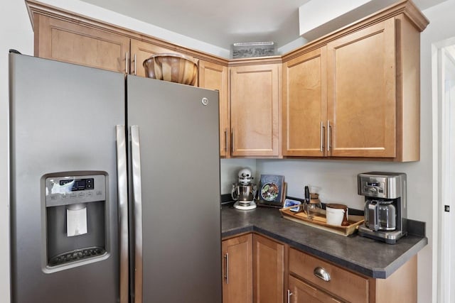 228 N Pleasant Ave, Jefferson, WI 53549 - kitchen with stainless steel fridge with ice dispenser and dark countertops
