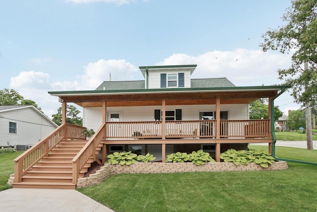 228 N Pleasant Ave, Jefferson, WI 53549 - view of front of home with a front lawn, a porch, roof with shingles, and stairway