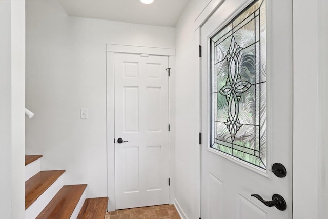 228 N Pleasant Ave, Jefferson, WI 53549 - foyer entrance with stairs and baseboards