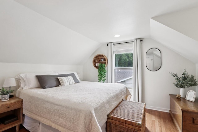 228 N Pleasant Ave, Jefferson, WI 53549 - bedroom with wood finished floors, vaulted ceiling, and recessed lighting