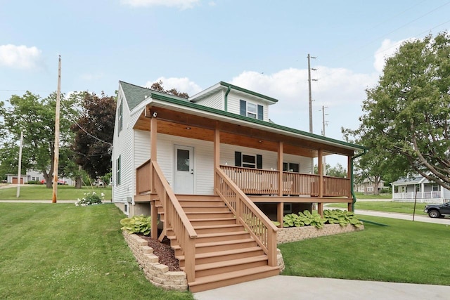 228 N Pleasant Ave, Jefferson, WI 53549 - view of front of property featuring covered porch, a front yard, and stairway