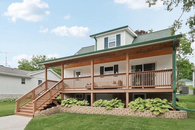 228 N Pleasant Ave, Jefferson, WI 53549 - view of front of house with a front lawn, covered porch, roof with shingles, and stairway