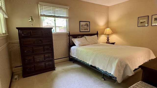3218 N 13th St, Wausau, WI 54403 - bedroom with carpet floors and baseboard heating