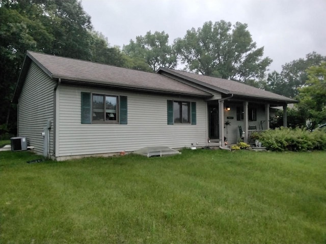 W5211 Fern Ave, Montello, WI 53949 - ranch-style house with a front lawn, a porch, and a shingled roof