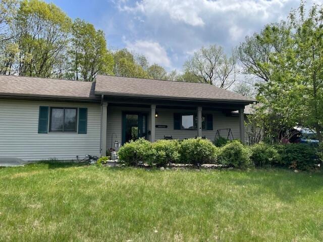 W5211 Fern Ave, Montello, WI 53949 - ranch-style house with a front lawn and covered porch