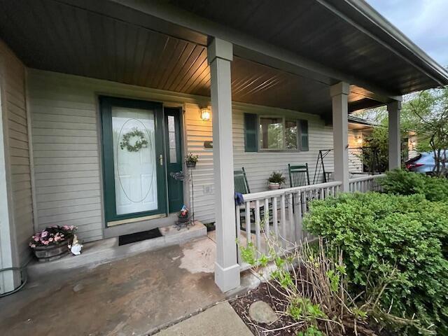 W5211 Fern Ave, Montello, WI 53949 - doorway to property featuring covered porch