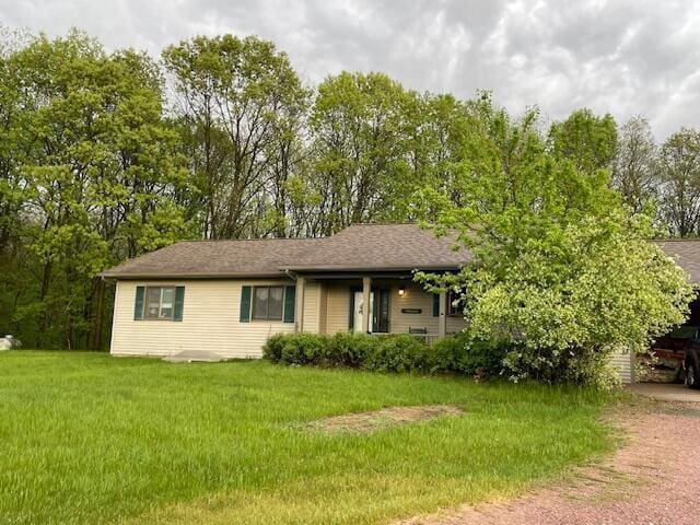 W5211 Fern Ave, Montello, WI 53949 - view of front of house with a front lawn