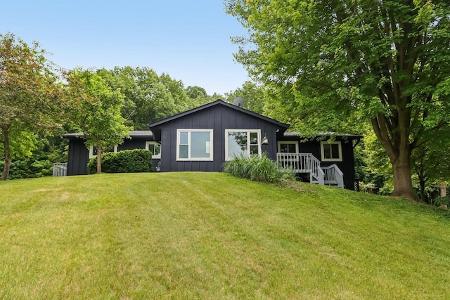 S83W27815 Beaver Trl, Mukwonago, WI 53149 - rear view of property with a yard, board and batten siding, and a deck