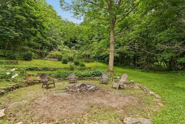 S83W27815 Beaver Trl, Mukwonago, WI 53149 - view of grassy yard with an outdoor fire pit