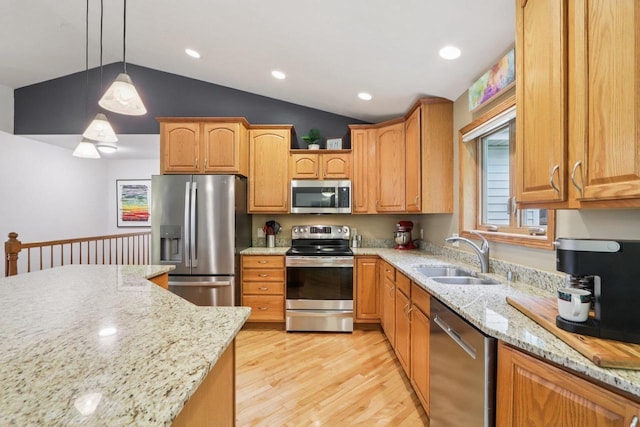 3176 Weybridge Dr, Sun Prairie, WI 53590 - kitchen with stainless steel appliances, light wood-type flooring, light stone counters, pendant lighting, and recessed lighting