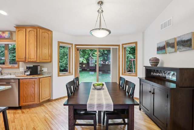 3176 Weybridge Dr, Sun Prairie, WI 53590 - dining area with light wood-style floors and baseboards