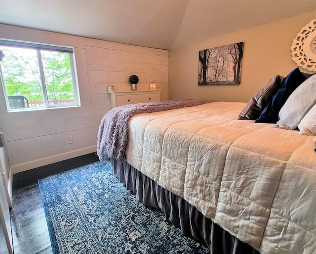 15531 Lakewood Dr, Hayward, WI 54843 - bedroom with wood finished floors, vaulted ceiling, and wood walls