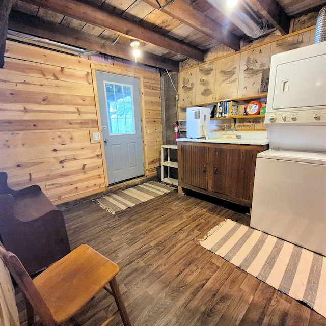 15531 Lakewood Dr, Hayward, WI 54843 - washroom with stacked washing machine and dryer, dark wood-style floors, wood ceiling, and wood walls