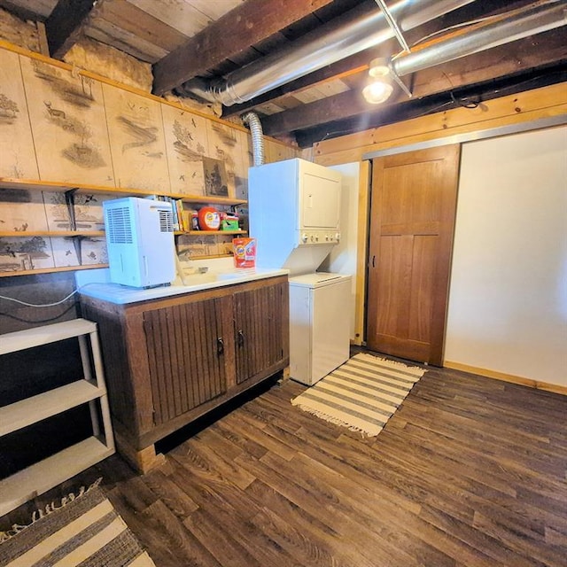 15531 Lakewood Dr, Hayward, WI 54843 - washroom featuring estacked washer and dryer and dark wood-style floors