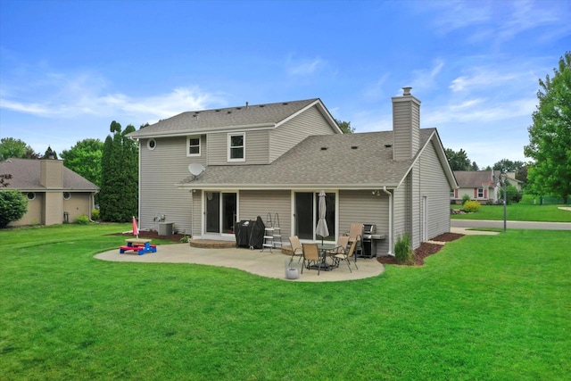 W163N10515 Ridgeview Ln, Germantown, WI 53022 - rear view of property with a patio area, a yard, a chimney, and a shingled roof