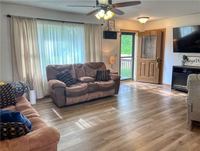 608 3rd St, Cameron, WI 54822 - living area with a ceiling fan and light wood-type flooring