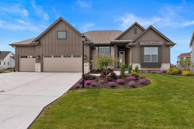 N55W19373 Red Crown Ln, Menomonee Falls, WI 53051 - craftsman-style house with board and batten siding, stone siding, a front yard, concrete driveway, and an attached garage