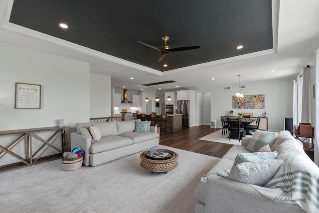 N55W19373 Red Crown Ln, Menomonee Falls, WI 53051 - living room with a raised ceiling, dark wood finished floors, a ceiling fan, and recessed lighting