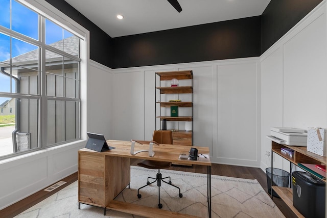N55W19373 Red Crown Ln, Menomonee Falls, WI 53051 - home office featuring wood finished floors and a decorative wall