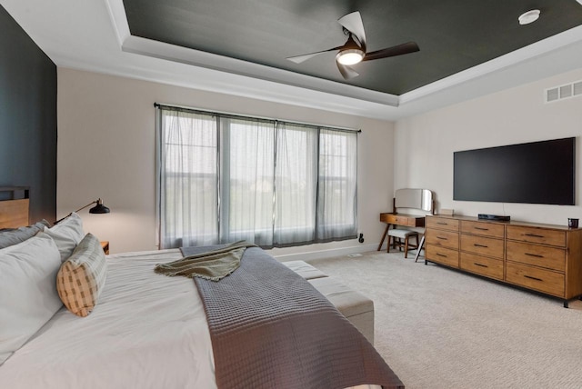 N55W19373 Red Crown Ln, Menomonee Falls, WI 53051 - bedroom featuring a tray ceiling, light colored carpet, and a ceiling fan