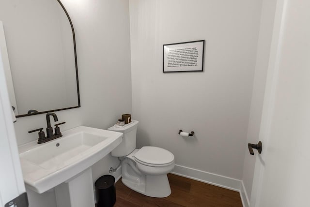 N55W19373 Red Crown Ln, Menomonee Falls, WI 53051 - bathroom with toilet and wood finished floors