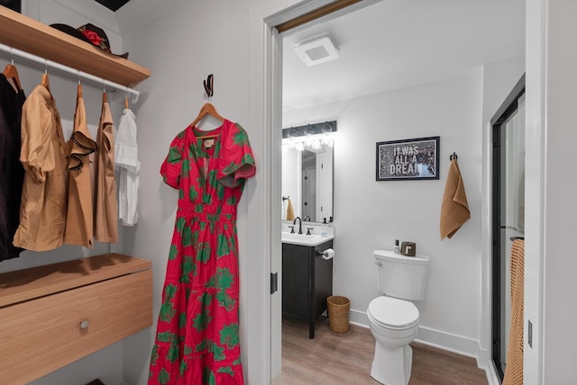N55W19373 Red Crown Ln, Menomonee Falls, WI 53051 - full bathroom with wood finished floors, vanity, and a shower with shower curtain