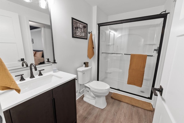N55W19373 Red Crown Ln, Menomonee Falls, WI 53051 - full bath featuring a shower stall, vanity, and wood finished floors
