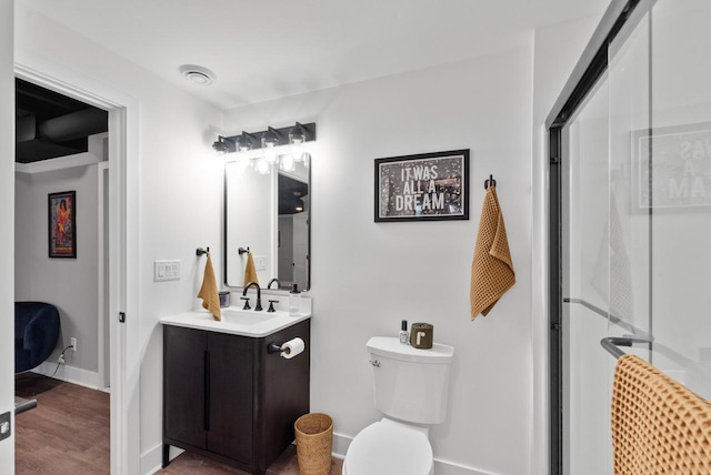 N55W19373 Red Crown Ln, Menomonee Falls, WI 53051 - full bathroom featuring vanity, a stall shower, and wood finished floors