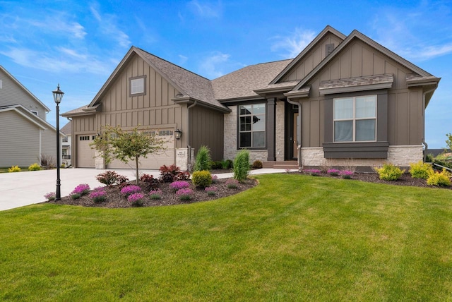 N55W19373 Red Crown Ln, Menomonee Falls, WI 53051 - craftsman house with board and batten siding, concrete driveway, a front lawn, an attached garage, and a shingled roof