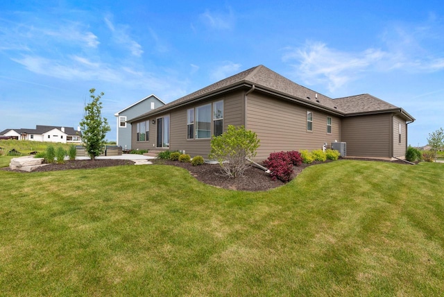 N55W19373 Red Crown Ln, Menomonee Falls, WI 53051 - view of side of property with a yard and a patio