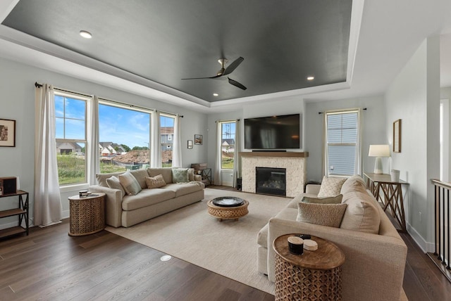 N55W19373 Red Crown Ln, Menomonee Falls, WI 53051 - living area with a tray ceiling, wood finished floors, a ceiling fan, and recessed lighting