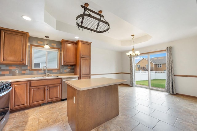 4815 Isabella Cir, Oneida, WI 54155 - kitchen with appliances with stainless steel finishes, a raised ceiling, brown cabinets, and recessed lighting