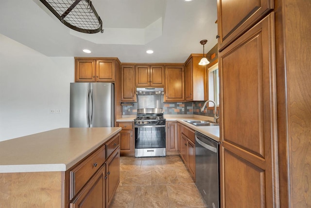 4815 Isabella Cir, Oneida, WI 54155 - kitchen featuring appliances with stainless steel finishes, under cabinet range hood, brown cabinetry, recessed lighting, and light countertops