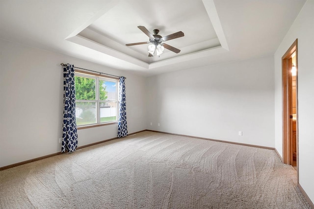 4815 Isabella Cir, Oneida, WI 54155 - empty room with carpet, ceiling fan, and a raised ceiling