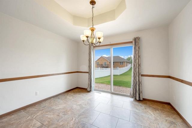 4815 Isabella Cir, Oneida, WI 54155 - spare room with a chandelier and a raised ceiling
