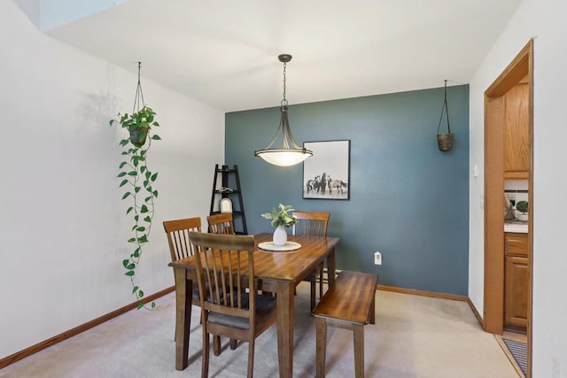 735 Cherokee Path, Lake Mills, WI 53551 - dining area featuring light carpet and baseboards