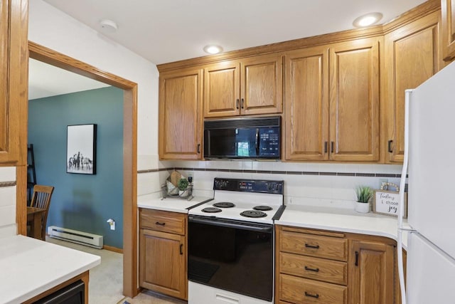 735 Cherokee Path, Lake Mills, WI 53551 - kitchen featuring black microwave, freestanding refrigerator, range with electric stovetop, a baseboard radiator, and tasteful backsplash