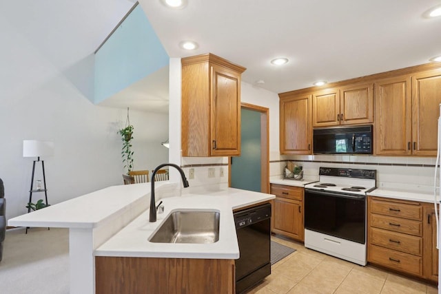 735 Cherokee Path, Lake Mills, WI 53551 - kitchen featuring black appliances, backsplash, light countertops, recessed lighting, and brown cabinets