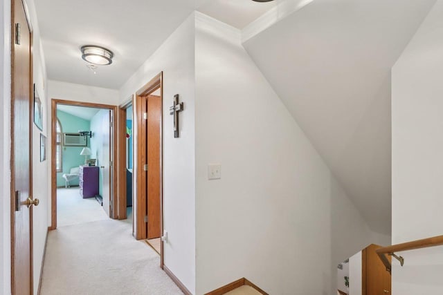 735 Cherokee Path, Lake Mills, WI 53551 - hallway with an upstairs landing, light carpet, and a wall mounted AC