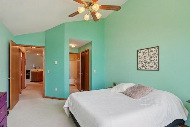 735 Cherokee Path, Lake Mills, WI 53551 - bedroom with vaulted ceiling, light carpet, a ceiling fan, and connected bathroom