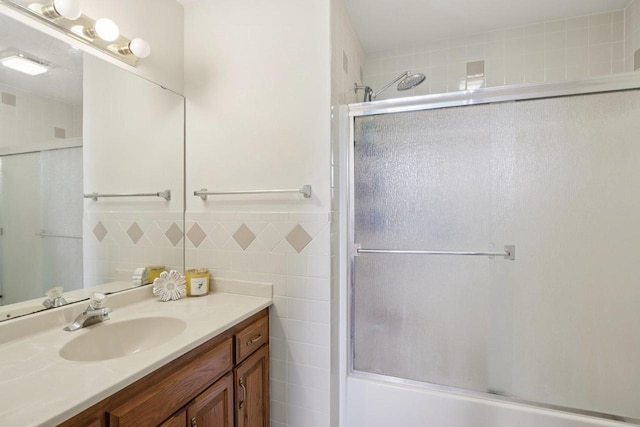 735 Cherokee Path, Lake Mills, WI 53551 - full bath featuring tile walls, a shower with door, and vanity