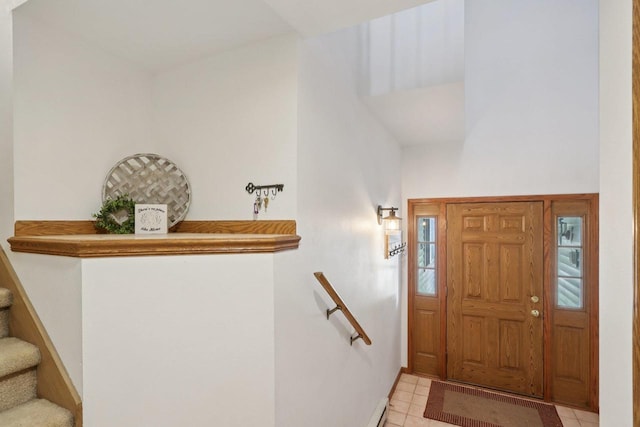 735 Cherokee Path, Lake Mills, WI 53551 - foyer entrance featuring light tile patterned flooring, stairs, and plenty of natural light