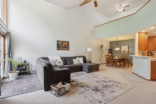 735 Cherokee Path, Lake Mills, WI 53551 - living area featuring light colored carpet, a ceiling fan, and a towering ceiling