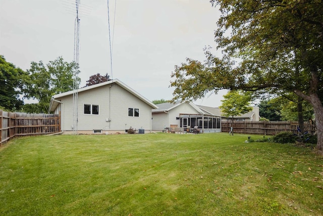 215 Marcoe St, Fond Du Lac, WI 54937 - fenced backyard featuring a sunroom